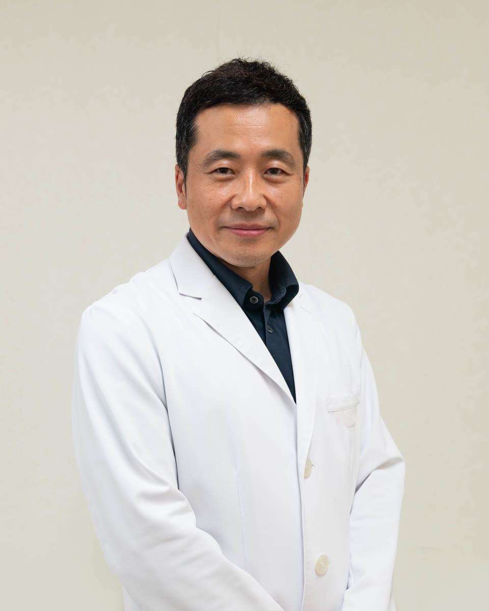 Dr. Hiro Katoh in a white coat
